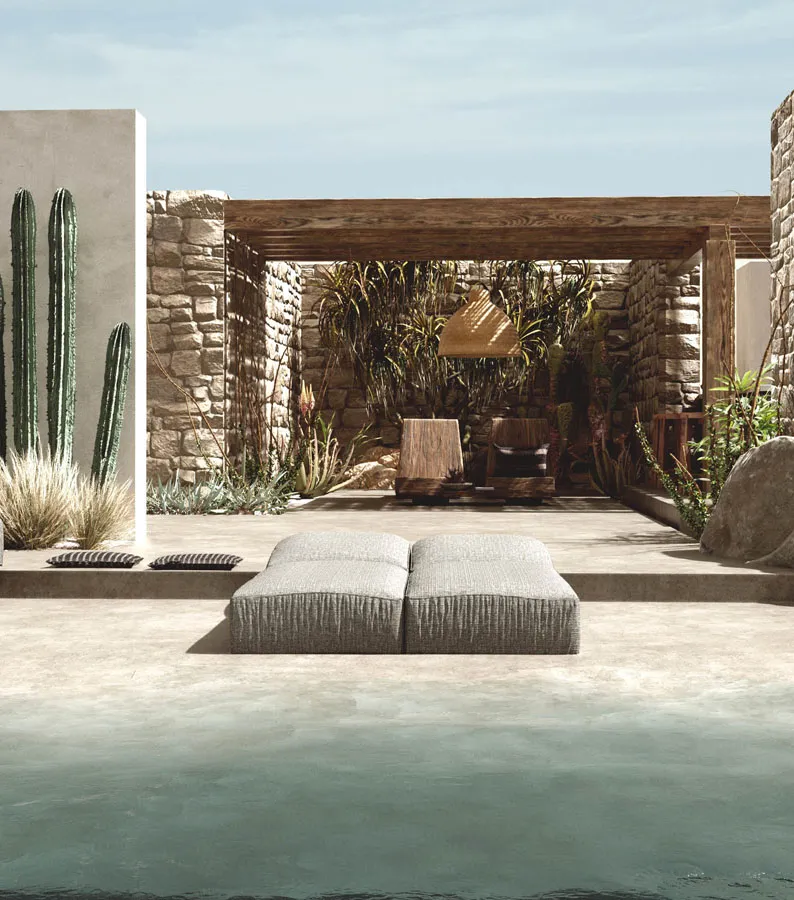 Rendering of a stone-walled courtyard with a timber pergola, cacti, a wide lounger and a pool in the foreground