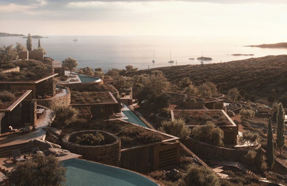 Shared Ground, Antiparos: guest houses with planted roofs and pools among olive trees on a hillside above the sea
