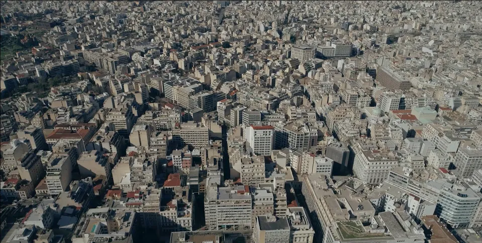 Aerial view over a dense city of apartment blocks