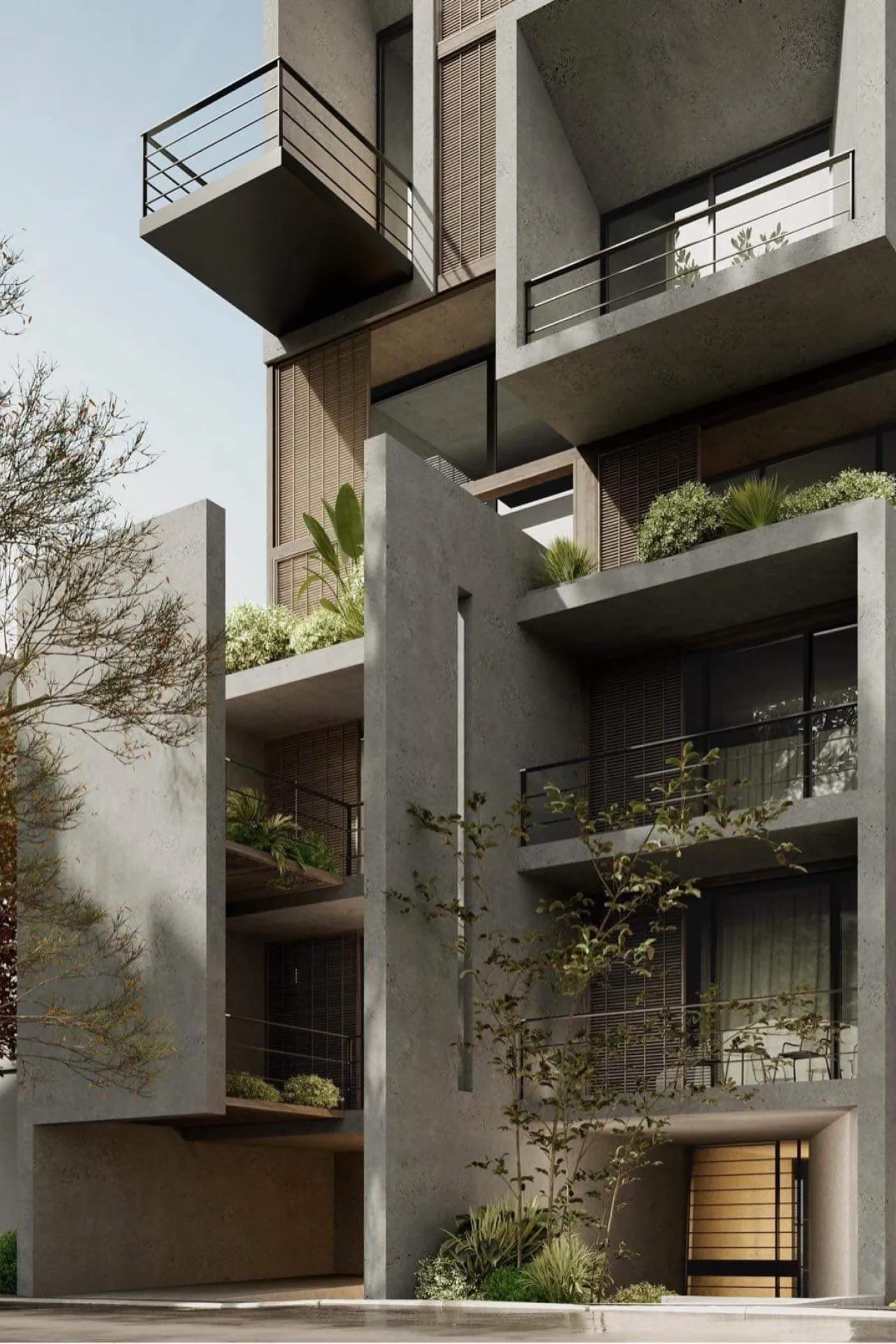 The corner of an apartment building with deep balconies, planters and climbing greenery