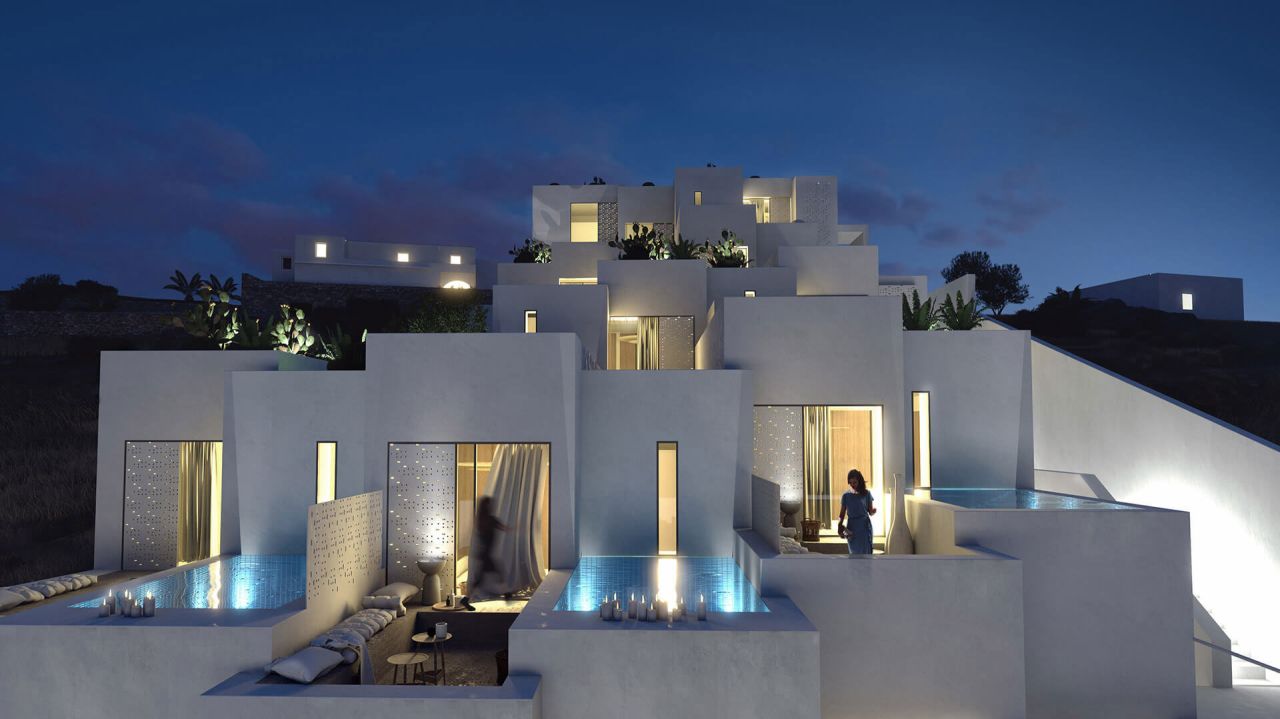 Rendering of a terraced white hillside complex at night with lit windows, small plunge pools and candlelit terraces