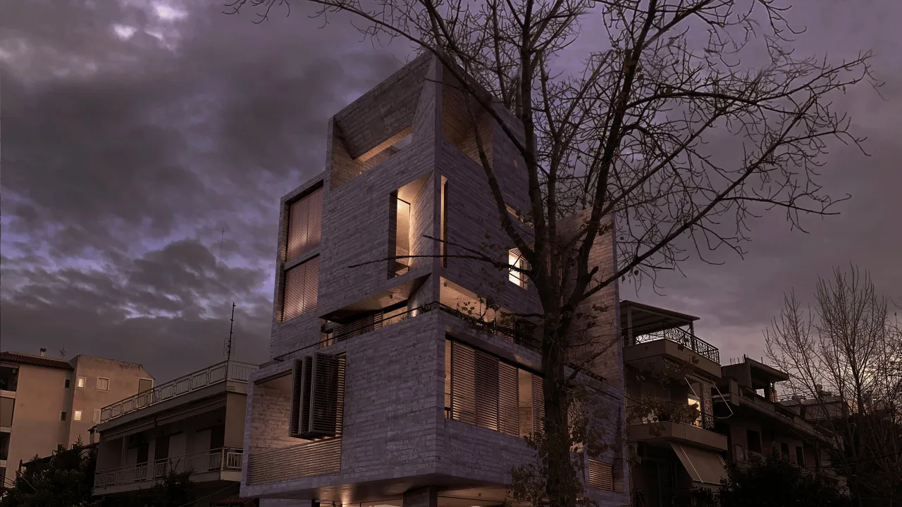 Casa Leone, Athens: a house of stacked volumes behind a bare tree at dusk