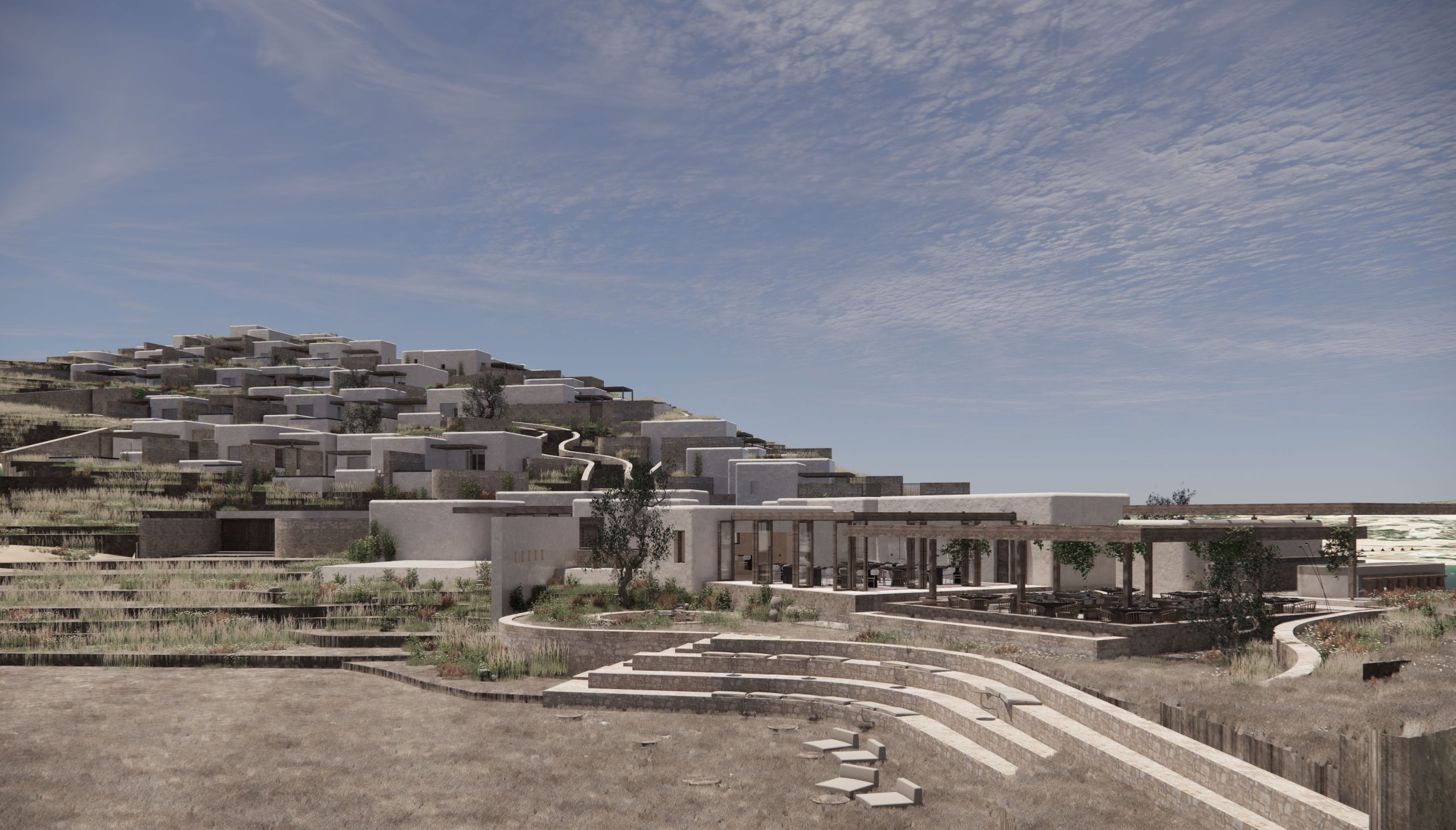 The hotel’s volumes rising up the hillside behind curved stone steps and planted terraces