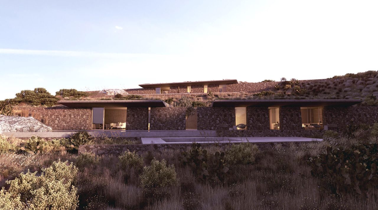 Rendering of Milos residence: low dark stone house with thin roofs stepping up a hillside among shrubs and prickly pear