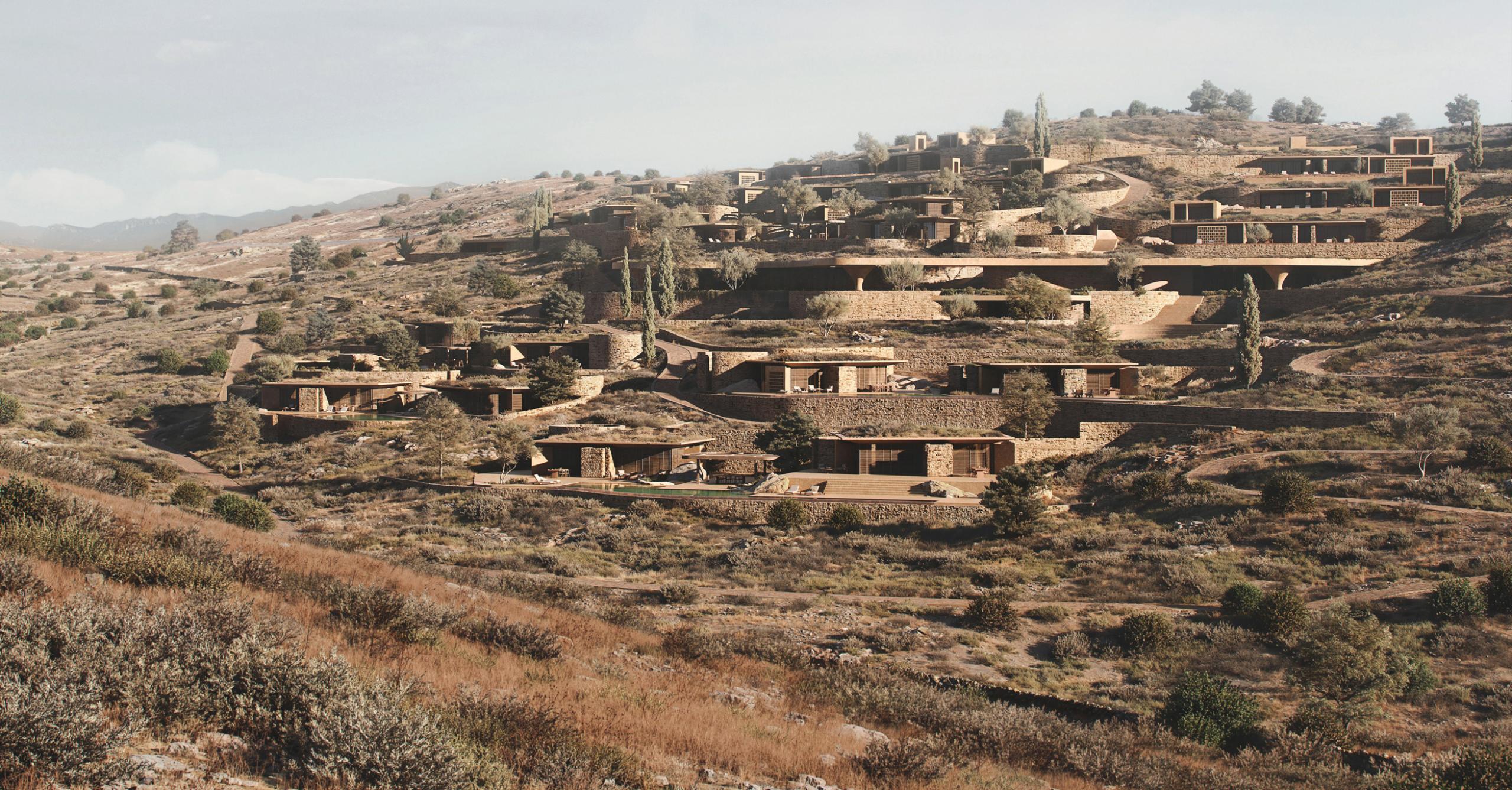Rendering of Shared Ground: residential volumes set into the terraced, scrub-covered hillside of a Cycladic island