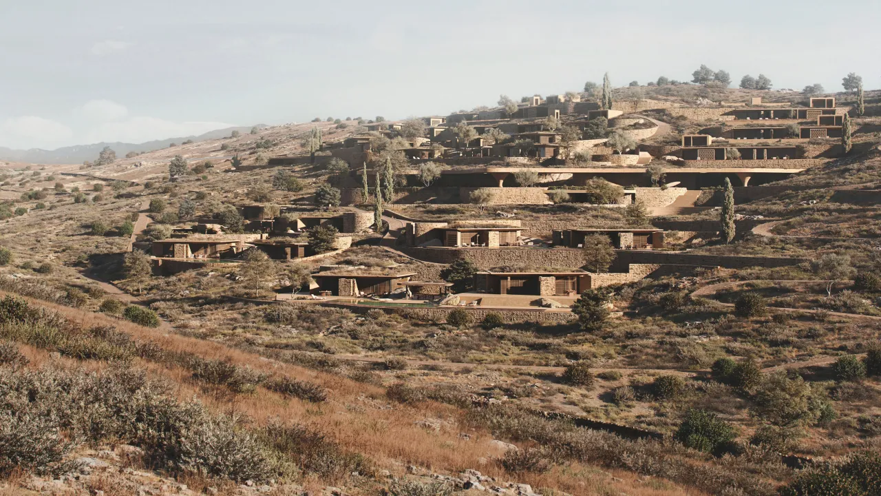 Rendering of Shared Ground: residential volumes set into the terraced, scrub-covered hillside of a Cycladic island