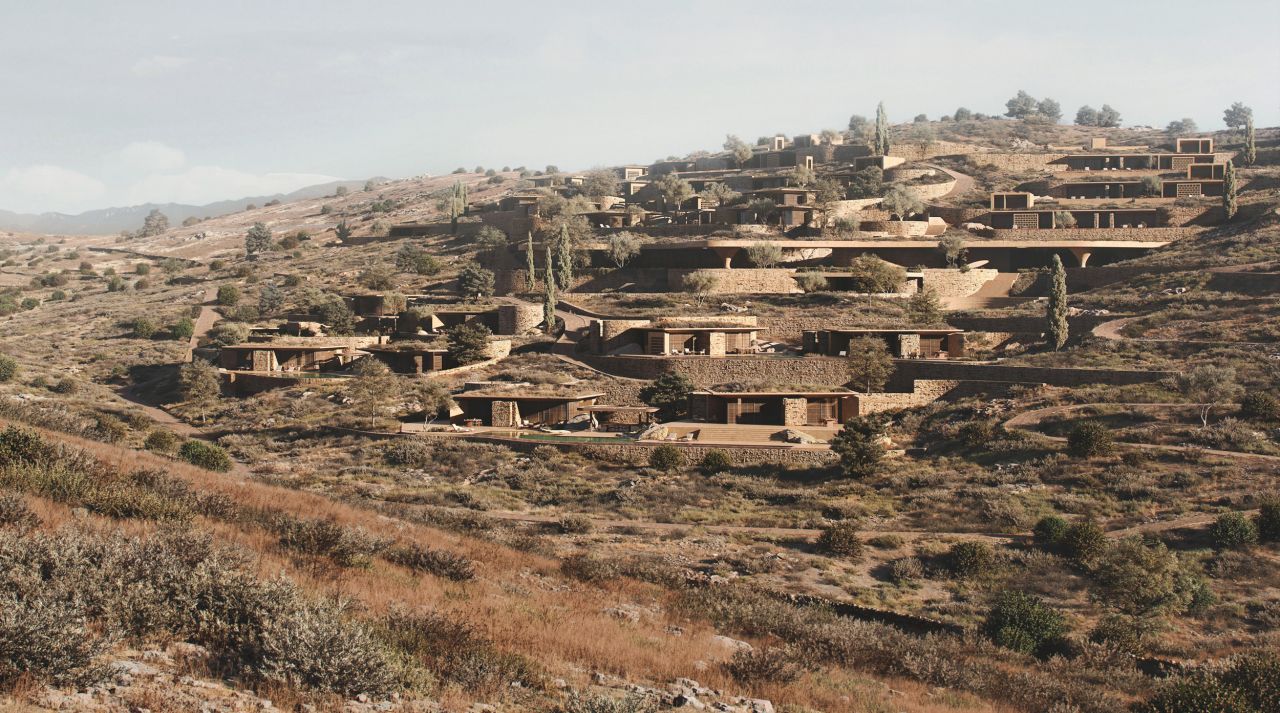 Rendering of Shared Ground: residential volumes set into the terraced, scrub-covered hillside of a Cycladic island