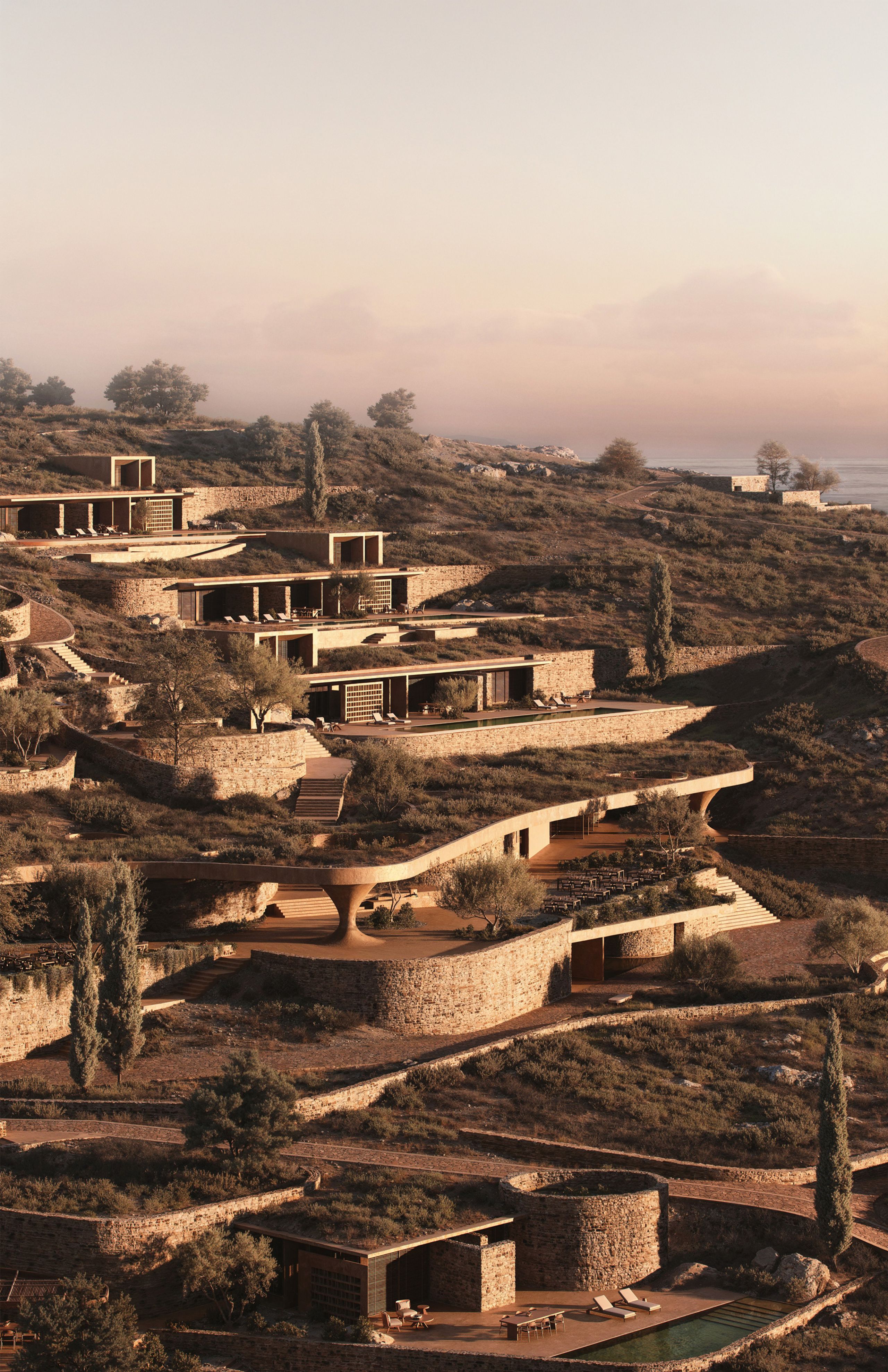 Rendering of Shared Ground at dusk, houses stepping down the slope under planted roofs, with the Aegean Sea on the horizon